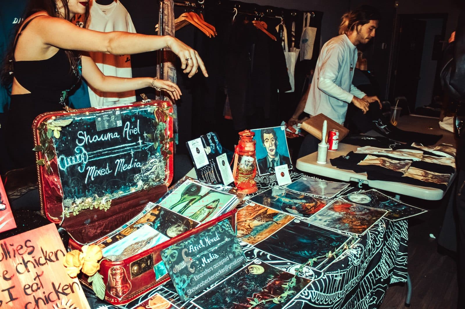 Local art and vendor table display at a Champions of Hope event