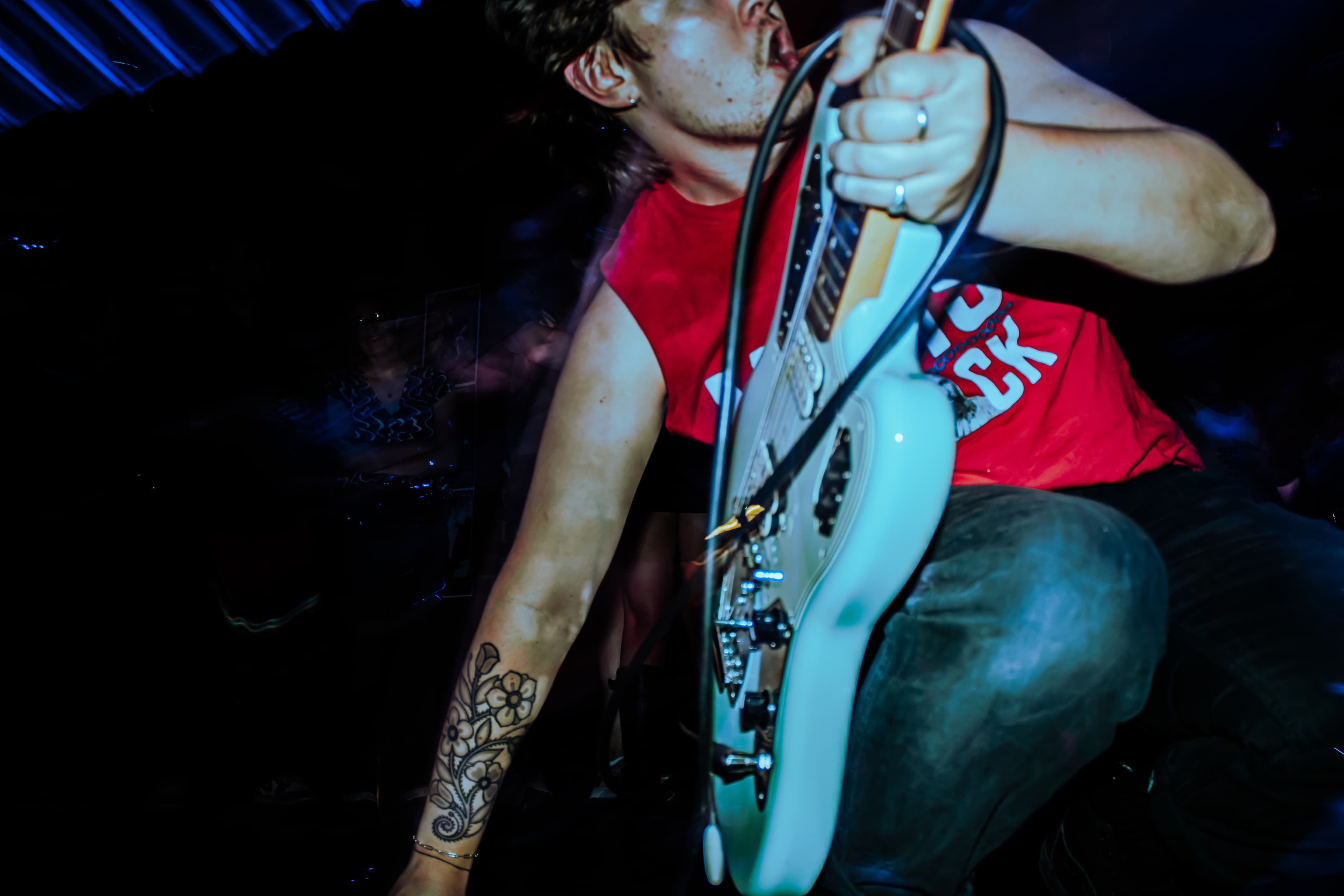 Close-up of a guitarist performing at a Champions of Hope show